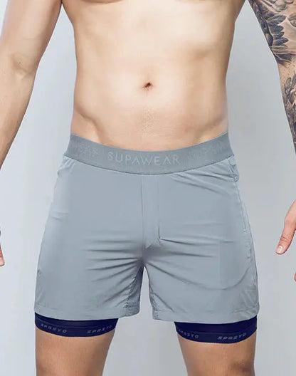 Gray supawear spr flex short athletic shorts with matching waistband and navy blue trim at the hem