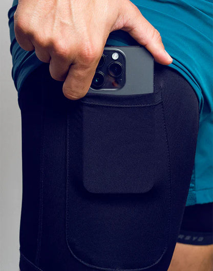 Black SPR FLEX SHORT athletic leggings with built-in pocket holding a dark gray smartphone