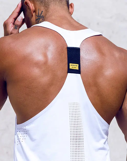 White athletic tank top with black mesh panel and yellow brand label on back side in spr y-tank design