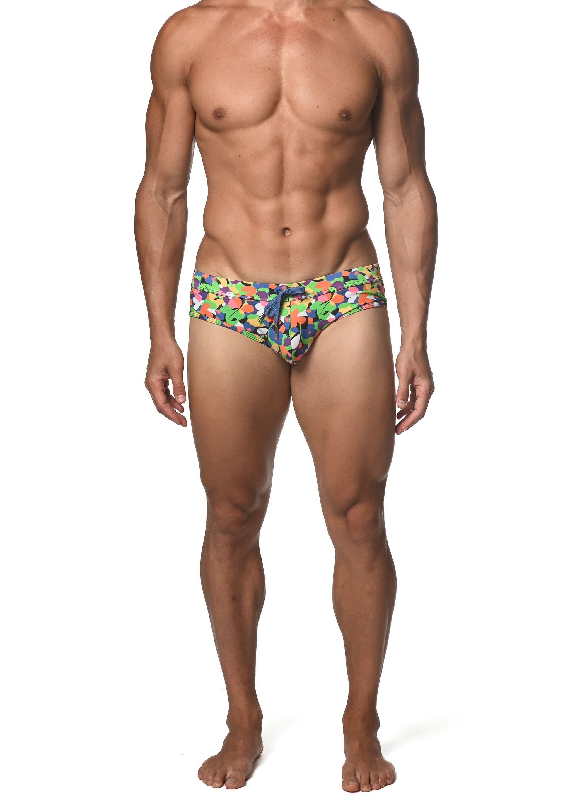 Spring green abstract freestyle swim brief with vibrant multicolored geometric pattern in green blue orange and purple
