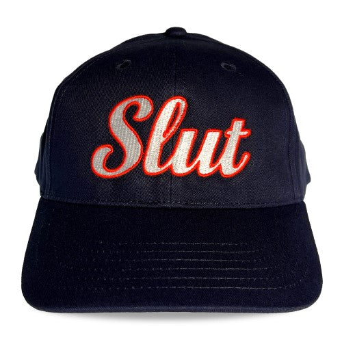 Black spunky monkee baseball cap with slut embroidered in red and white thread on the front panel