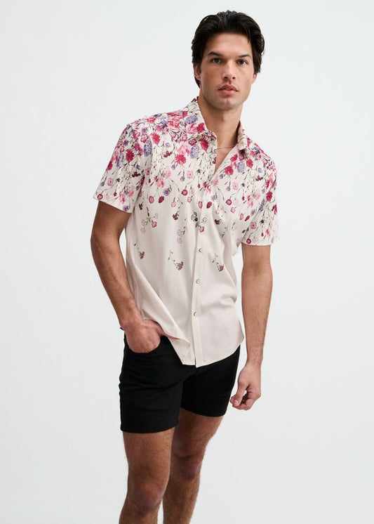 A short-sleeve button-down shirt in blush with fuchsia and purple floral border print.