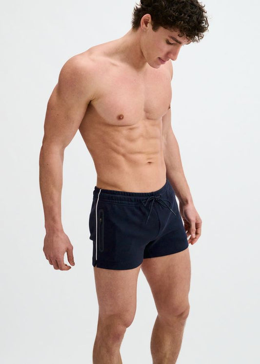 Navy blue gym shorts with white piping and a drawstring waist, viewed from the front against a white background.