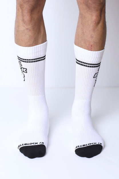 White starter crew socks with black toe caps two stripes and subtle logo on each leg made from soft cotton blend