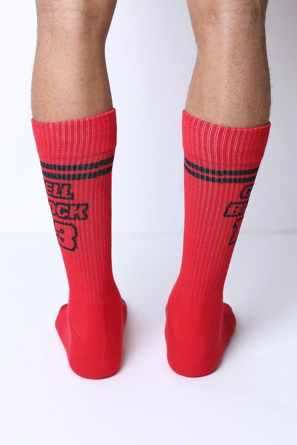 Starter crew socks featuring red crew socks with black horizontal stripes and bold hell buck 3 text