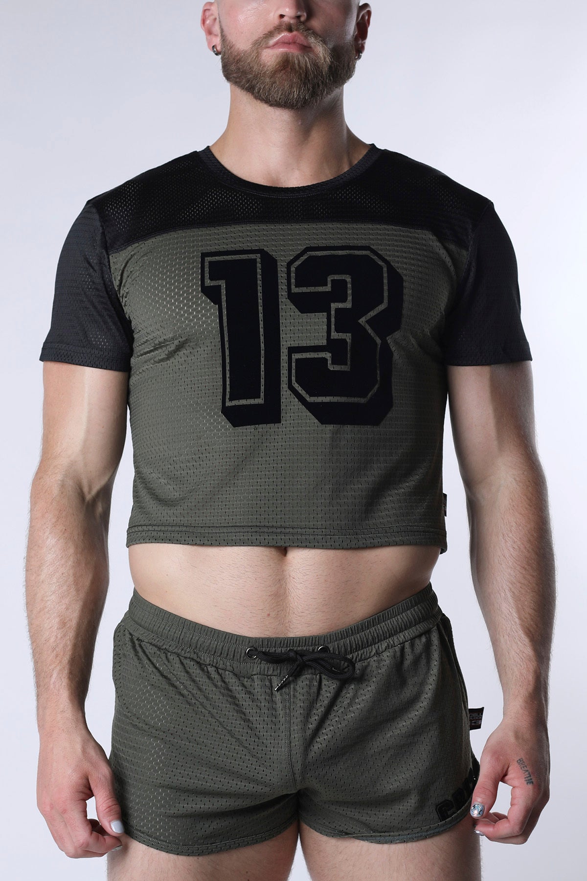 Starter mesh crop top featuring an olive green mesh body, black short sleeves, and a bold 13 graphic on the chest