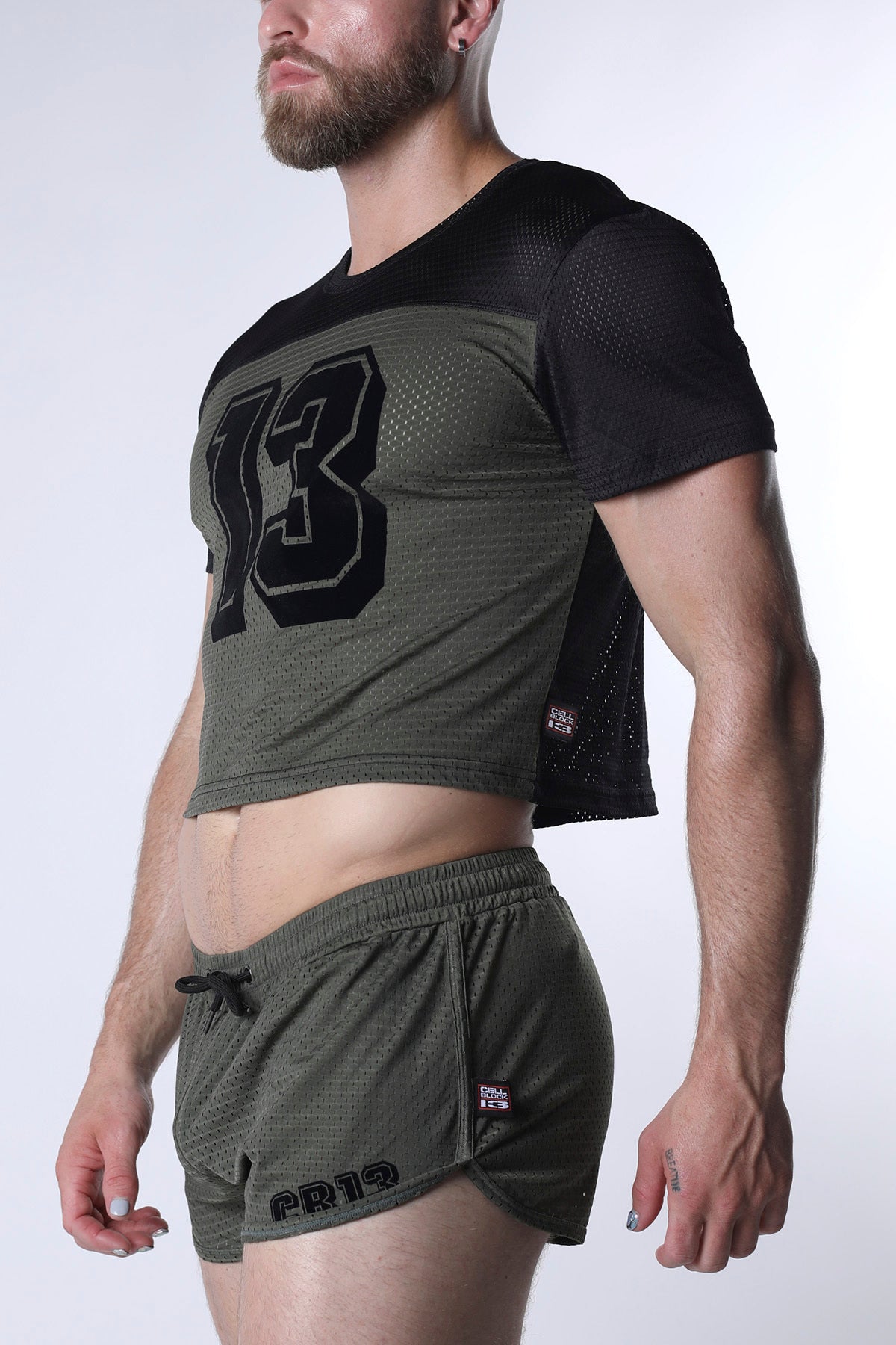 Olive green starter mesh crop top with black number 13 and side panels paired with matching shorts
