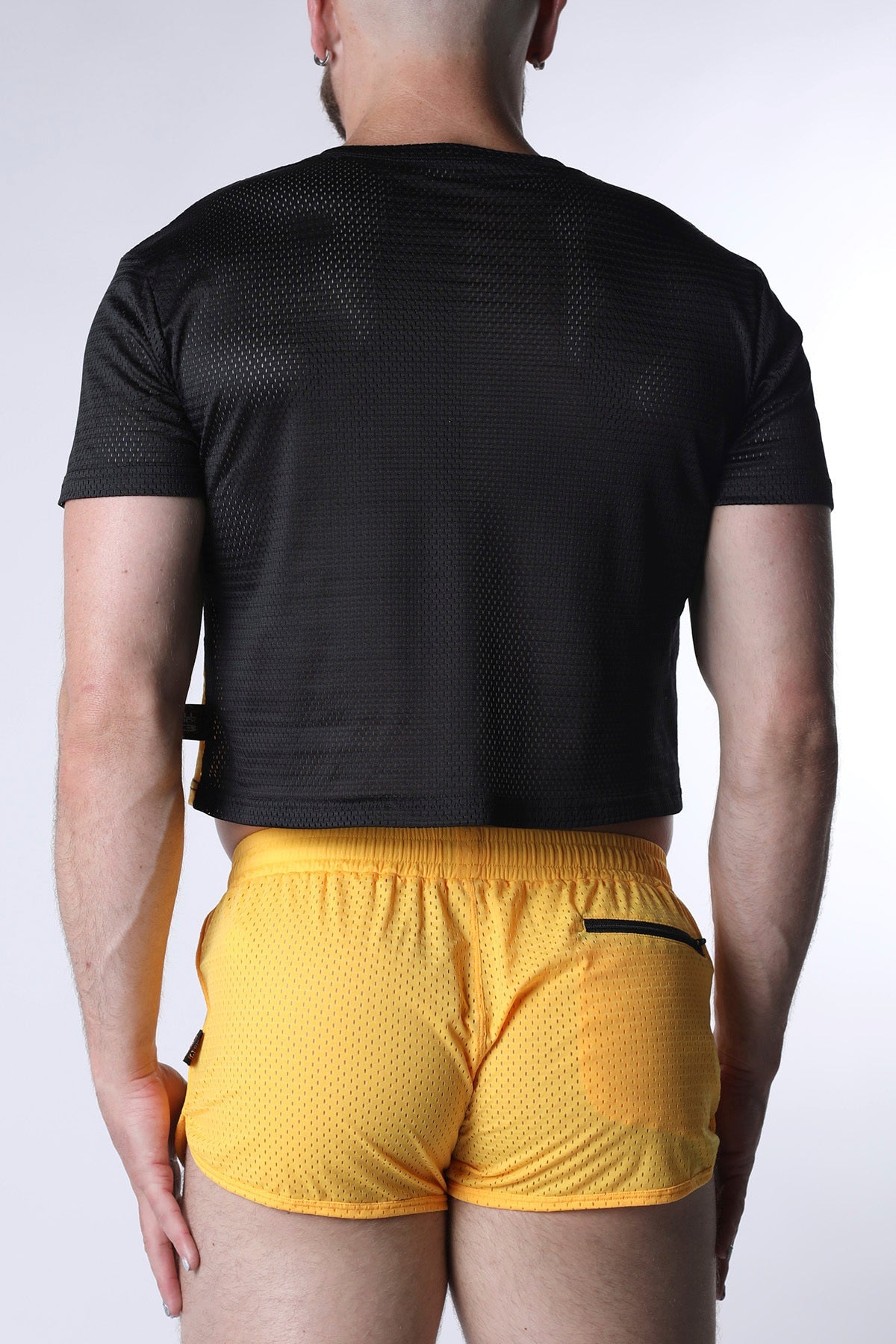 Starter mesh crop top black short-sleeved with subtle textured pattern and matching black side straps