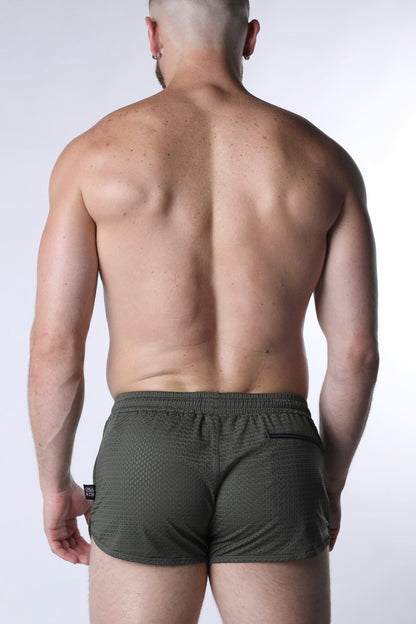 Olive green textured starter mesh athletic shorts with black side pocket and brand tag for sports use