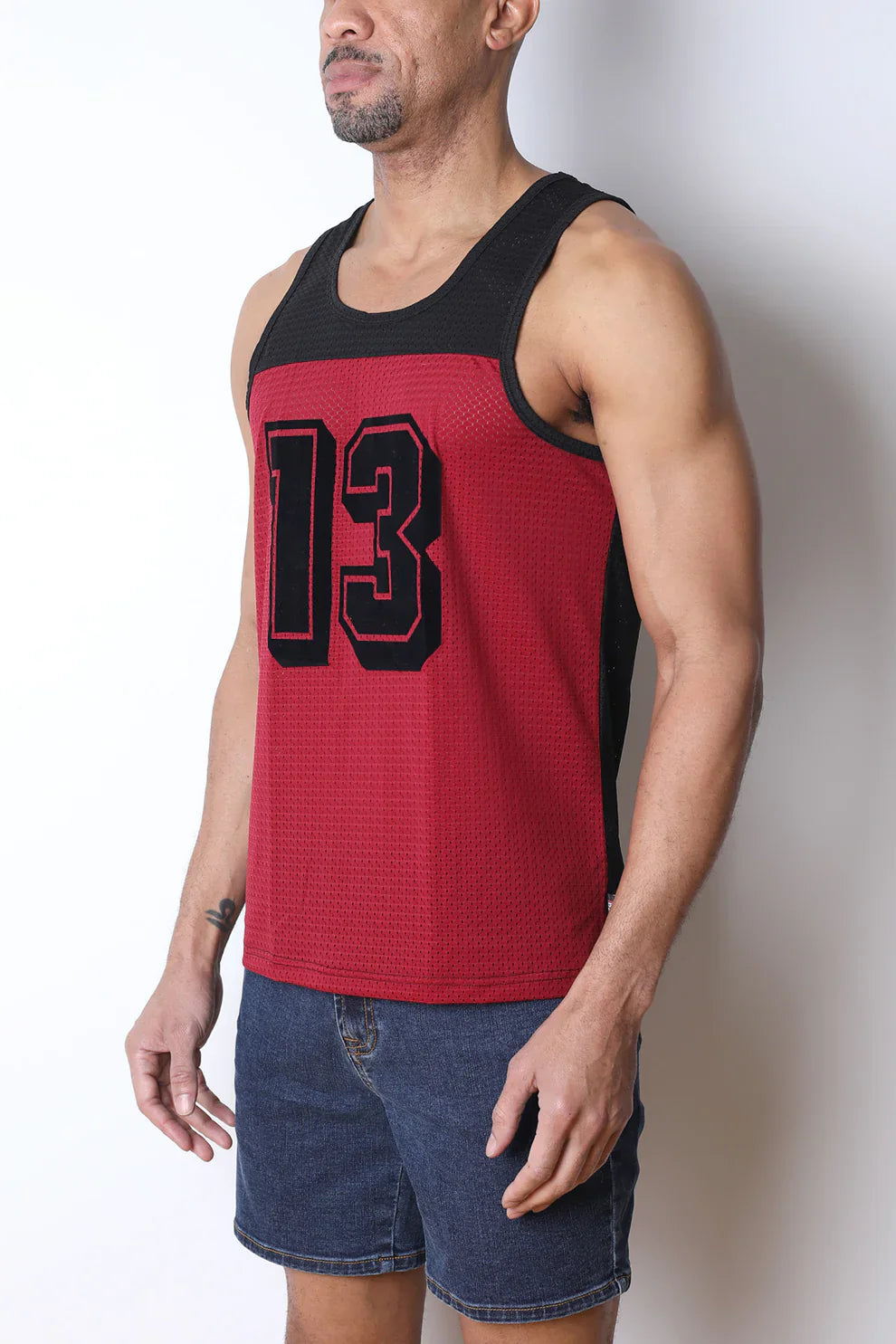 Starter mesh tank top in red and black textured knit fabric featuring bold 13 numerals across the chest