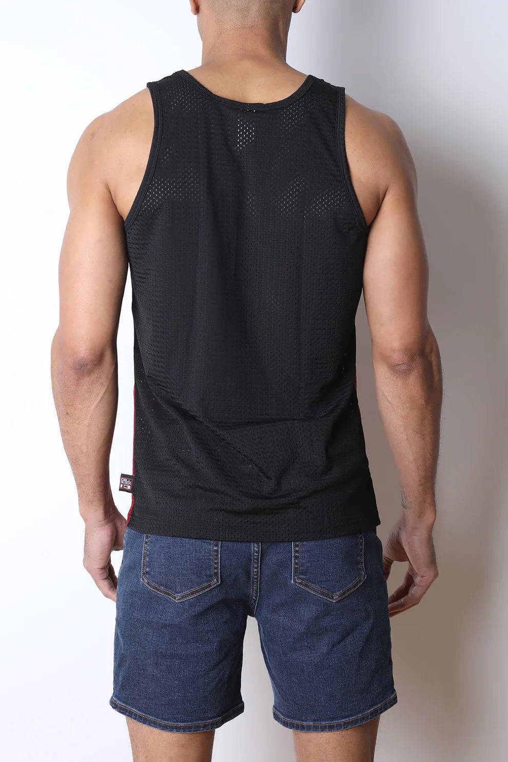 Black starter mesh tank top with subtle perforated texture and a small brand tag at the bottom hem