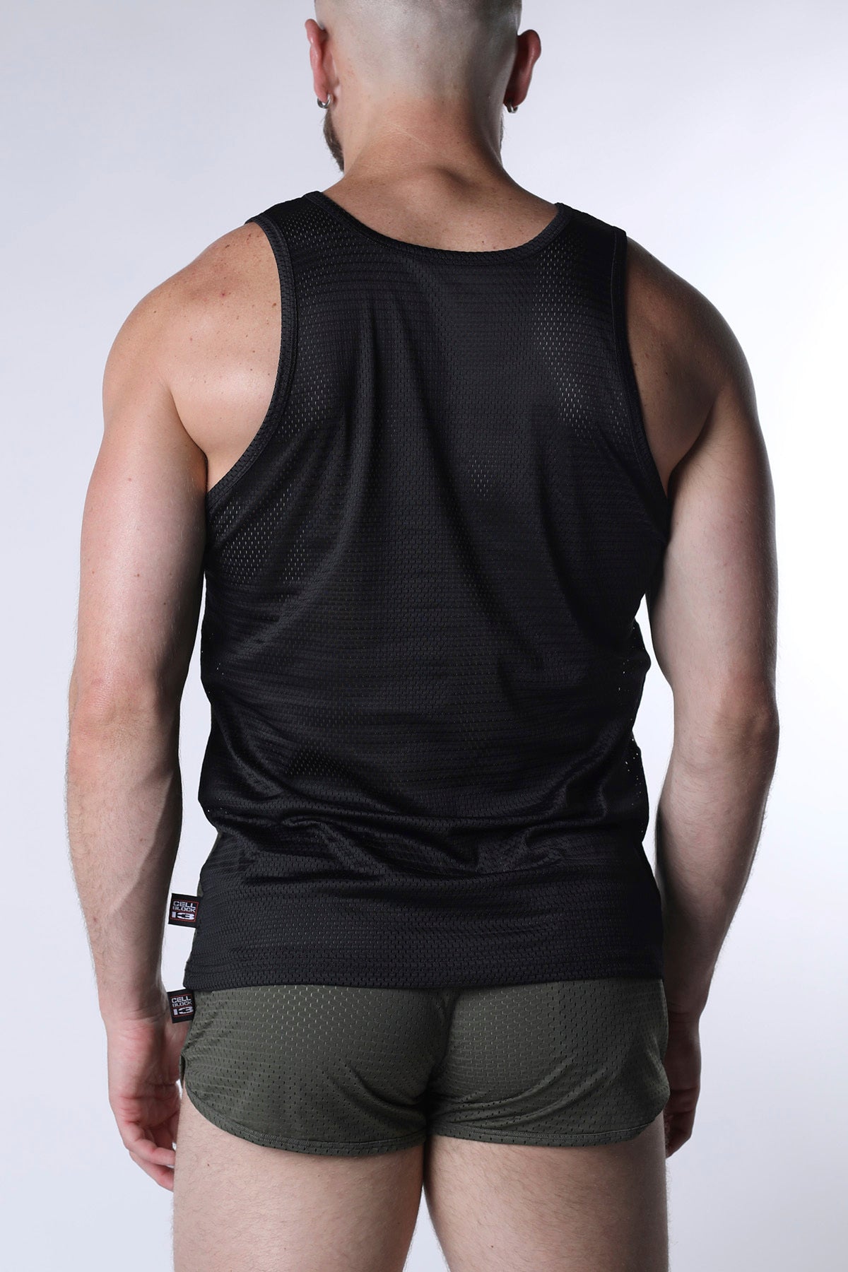 Black mesh starter tank top with fitted athletic cut made from breathable mesh material for active wear