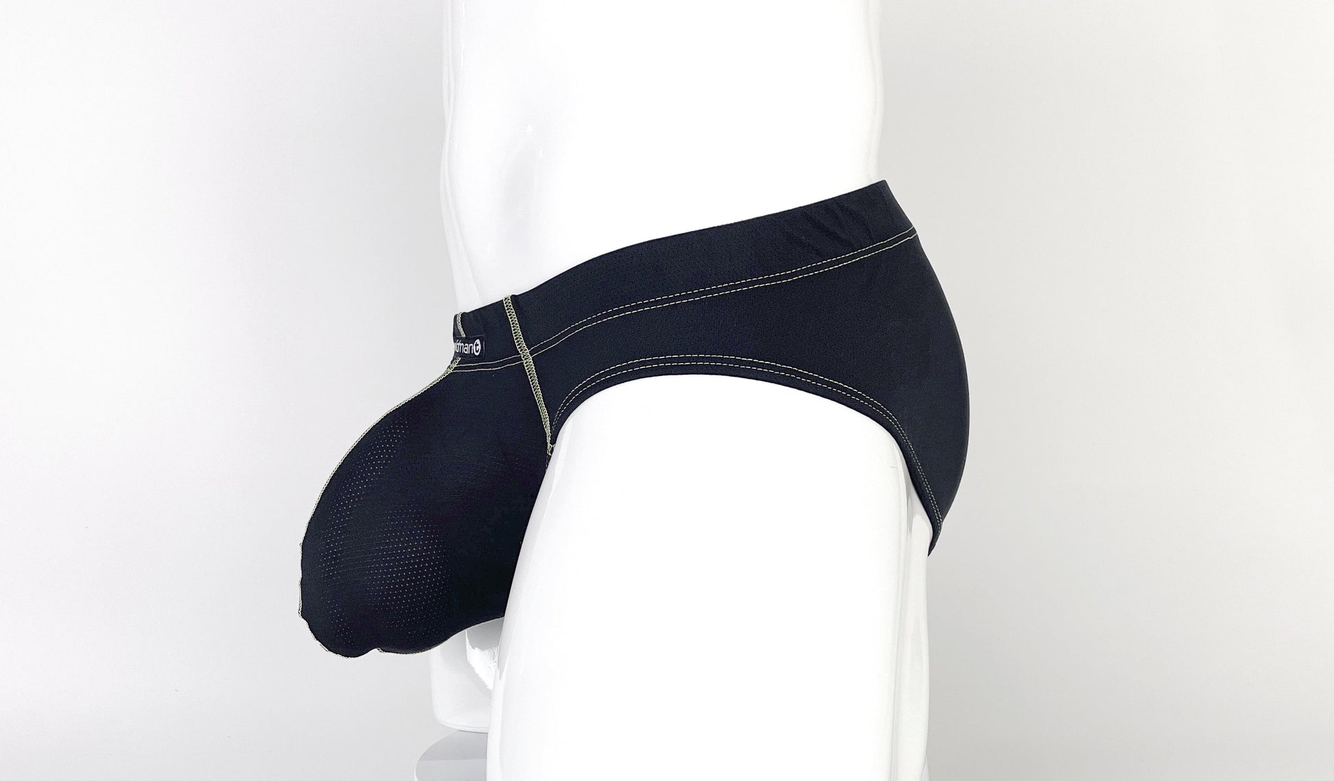 Black Stitch Big Boy pouch brief on a mannequin, featuring textured fabric and contrasting yellow stitching detail.