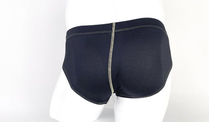 Black mesh pouch briefs on a mannequin with prominent, light-colored contrast stitching.