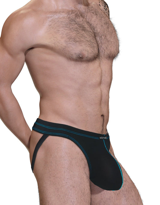 Side view of a man wearing a black jockstrap with a spacious front pouch and prominent blue contrast stitching.
