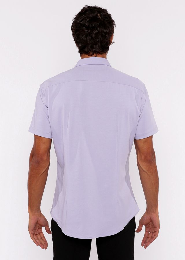 A man wearing a lavender stretch knit shirt with a classic collar and tailored fit in lightweight fabric
