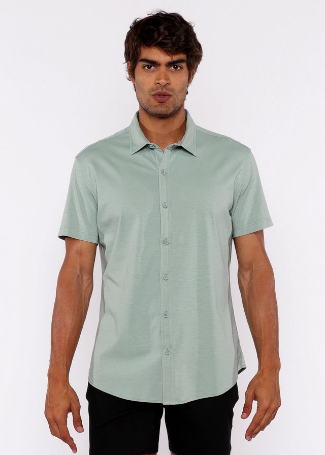 A light green stretch knit shirt with short sleeves and classic collar featuring neatly stitched seams