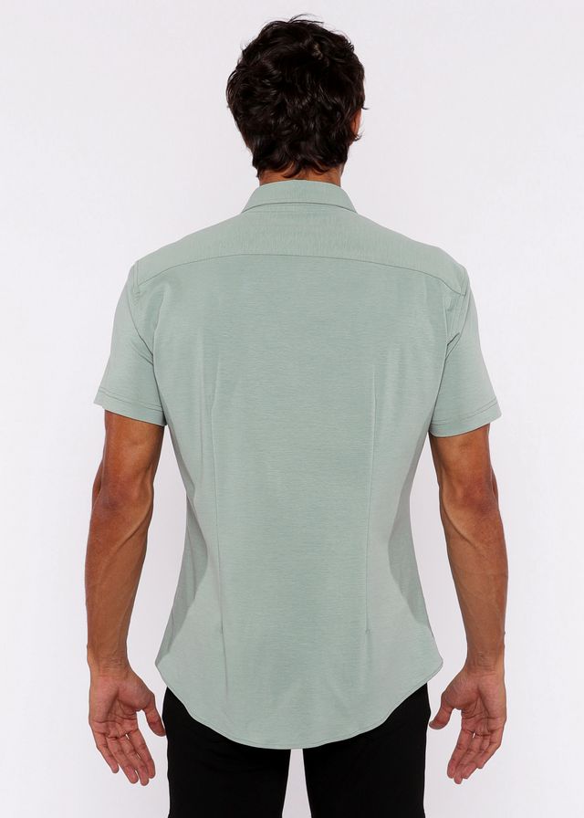 A light green stretch knit shirt for men with short sleeves tailored fit and subtle stitching details