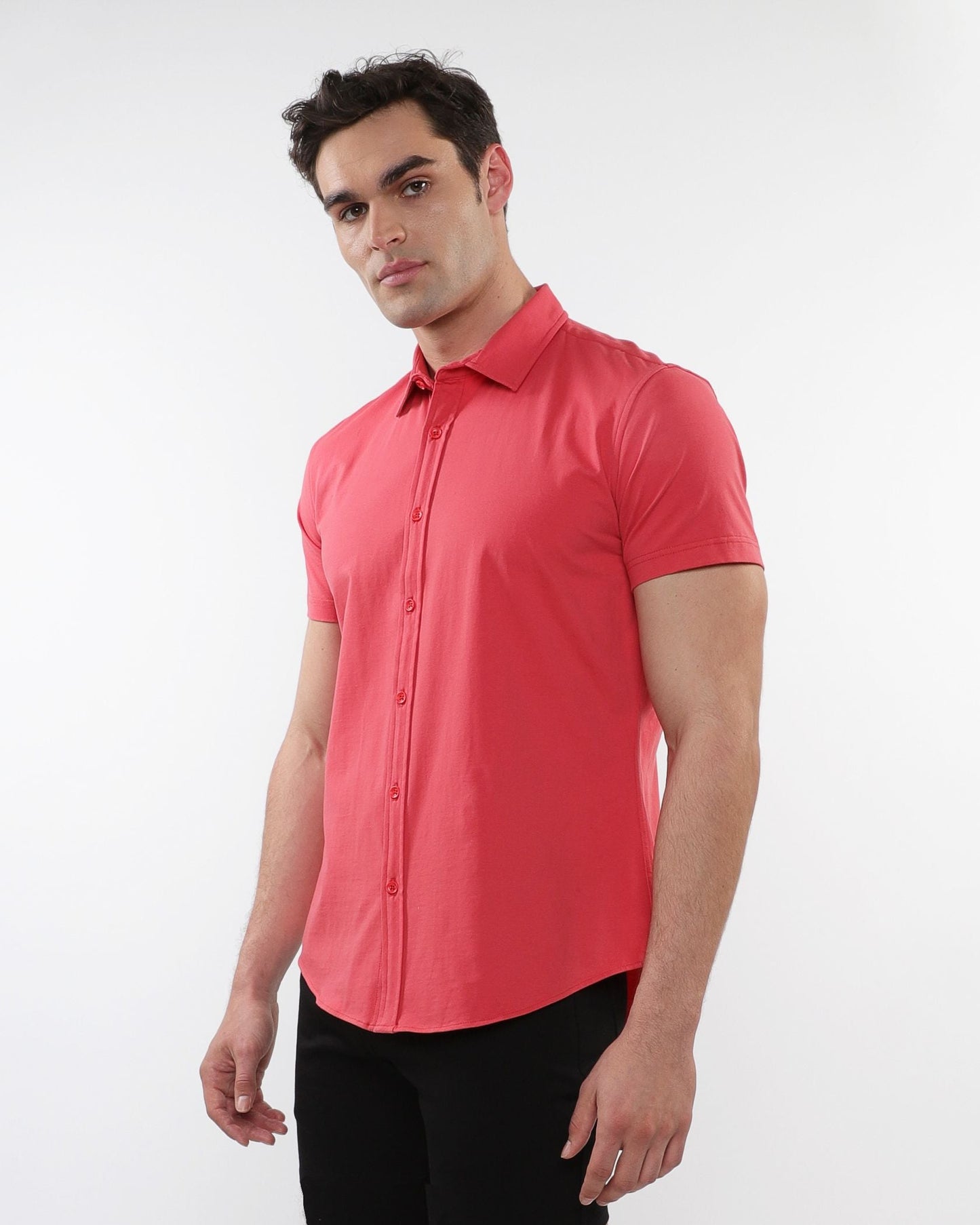 A vibrant coral stretch knit shirt with short sleeves, button-up front, classic collar, and tailored fit