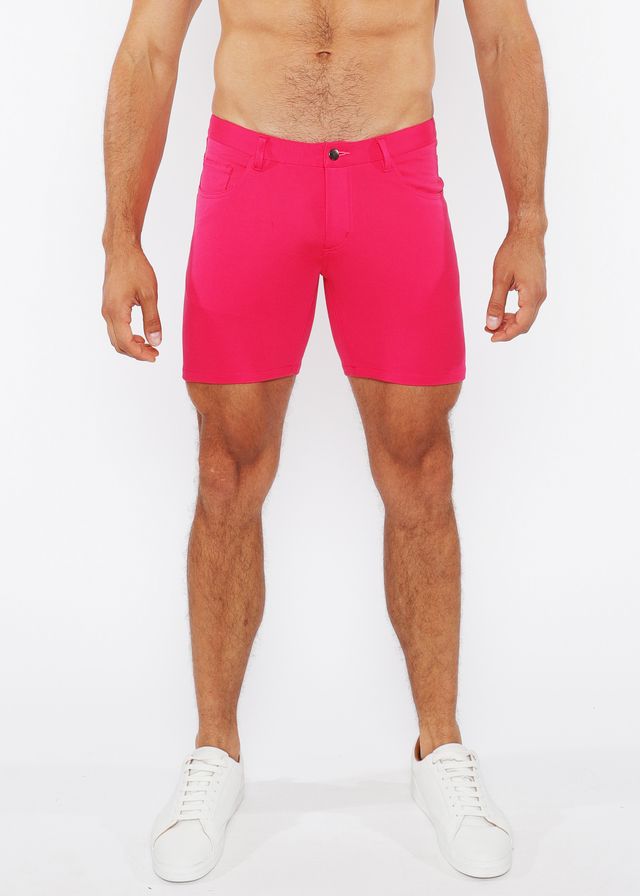 Bright pink stretch knit shorts for men with a tailored fit and single button closure