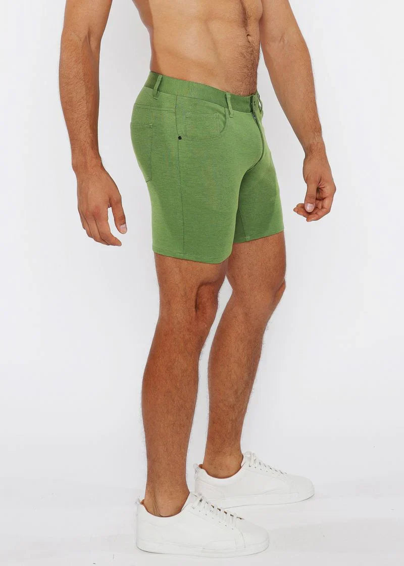 Green stretch knit shorts with classic five-pocket design and belt loop waistband in denim fabric