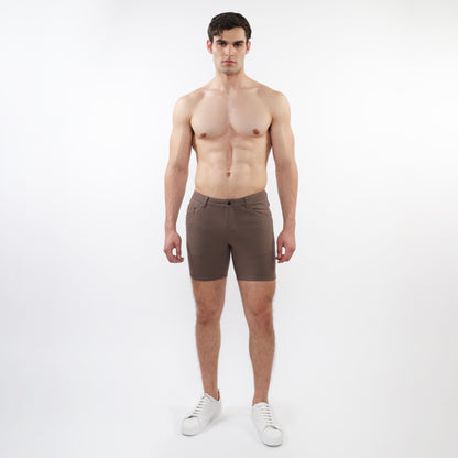 A pair of slim-fit dark brown stretch knit shorts with a modern design and subtle stitching details