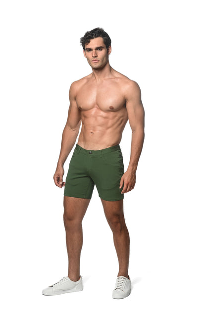 A pair of dark green stretch knit slim-fit chino shorts with five-pocket design and belt loops
