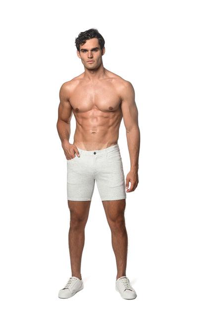 White stretch knit shorts with classic five-pocket design and button closure for casual summer wear