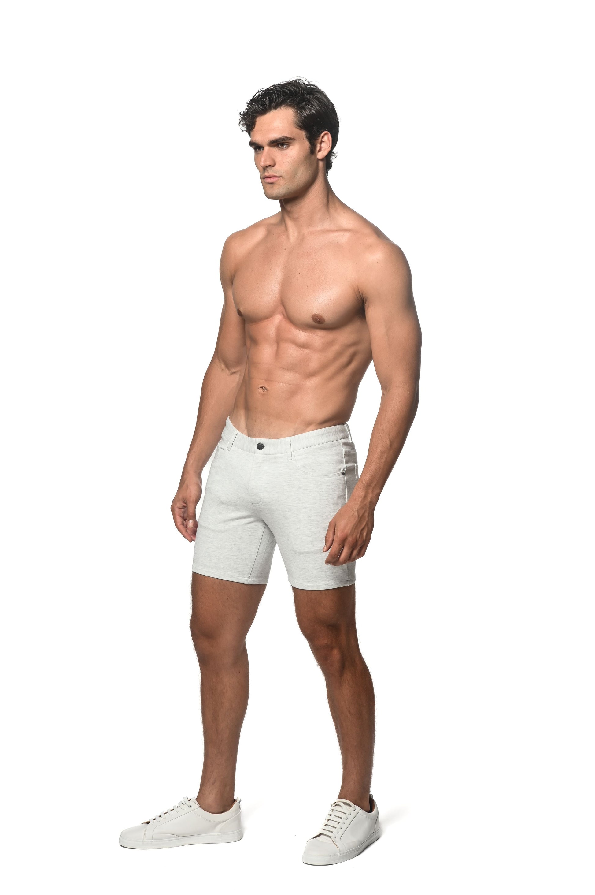 White stretch knit shorts with classic five-pocket design and button closure in denim material
