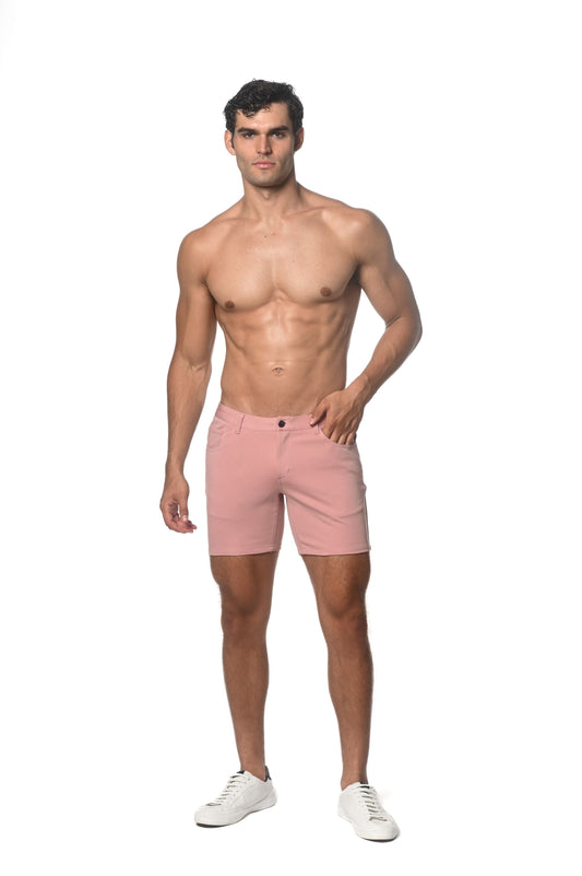 A pair of men’s pink stretch knit shorts with a classic tailored cut and single button closure