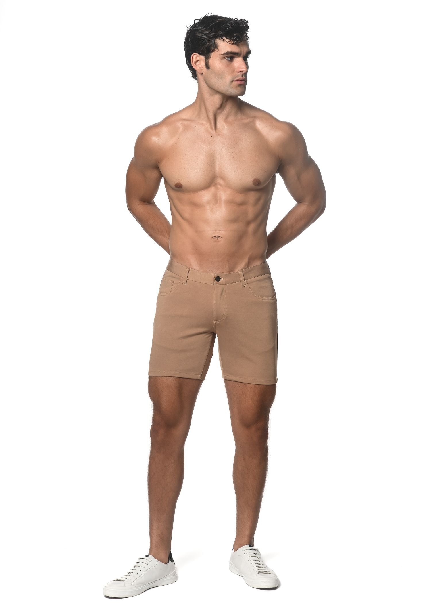 Beige stretch knit chino shorts with classic fit and button closure for comfortable casual wear
