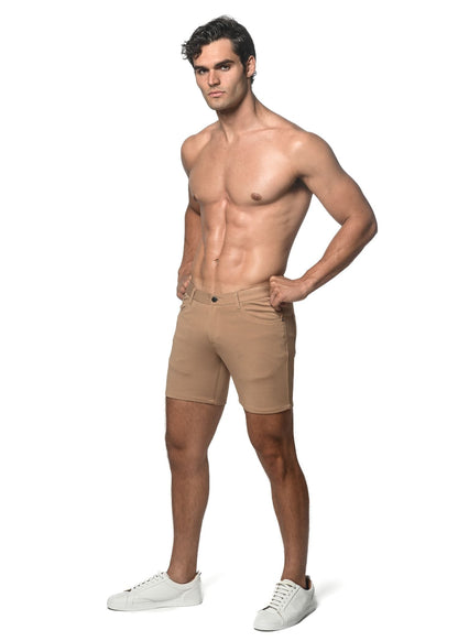 Beige stretch knit shorts with tailored fit and classic five-pocket design for athletic use