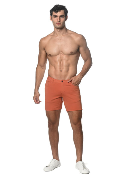 Orange stretch knit shorts with button closure and belt loops for comfortable casual wear