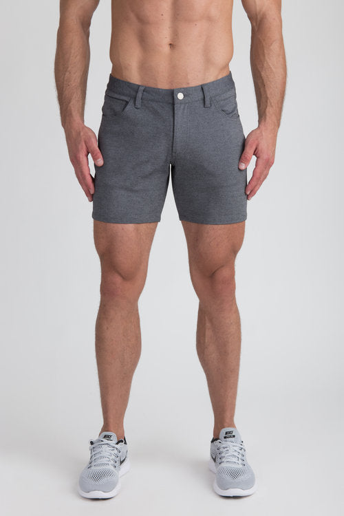 Gray stretch knit shorts with textured fabric button closure and side pockets for casual wear