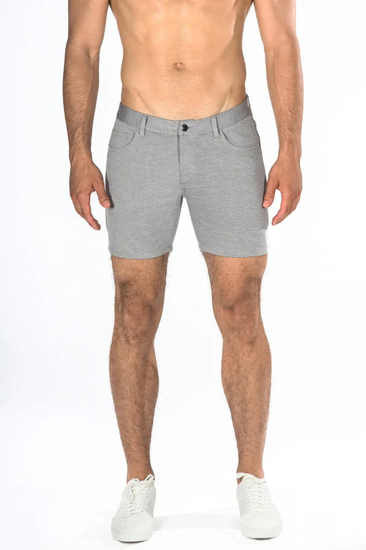 Gray stretch knit shorts with heathered fabric and subtle stitching details for a sleek, modern look