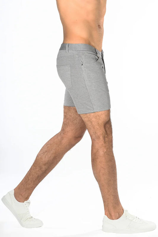 Gray stretch knit shorts with textured fabric and subtle stitching details in a sleek modern design