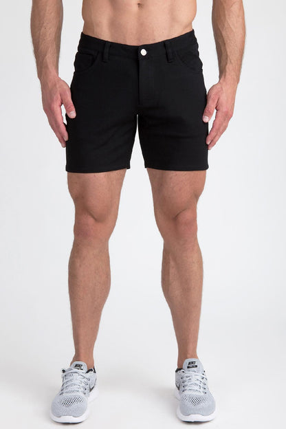 Black stretch knit shorts with a classic five-pocket design and a single white button closure
