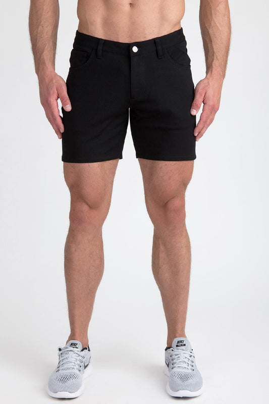 Black stretch knit shorts with a classic five-pocket design and a single white button closure