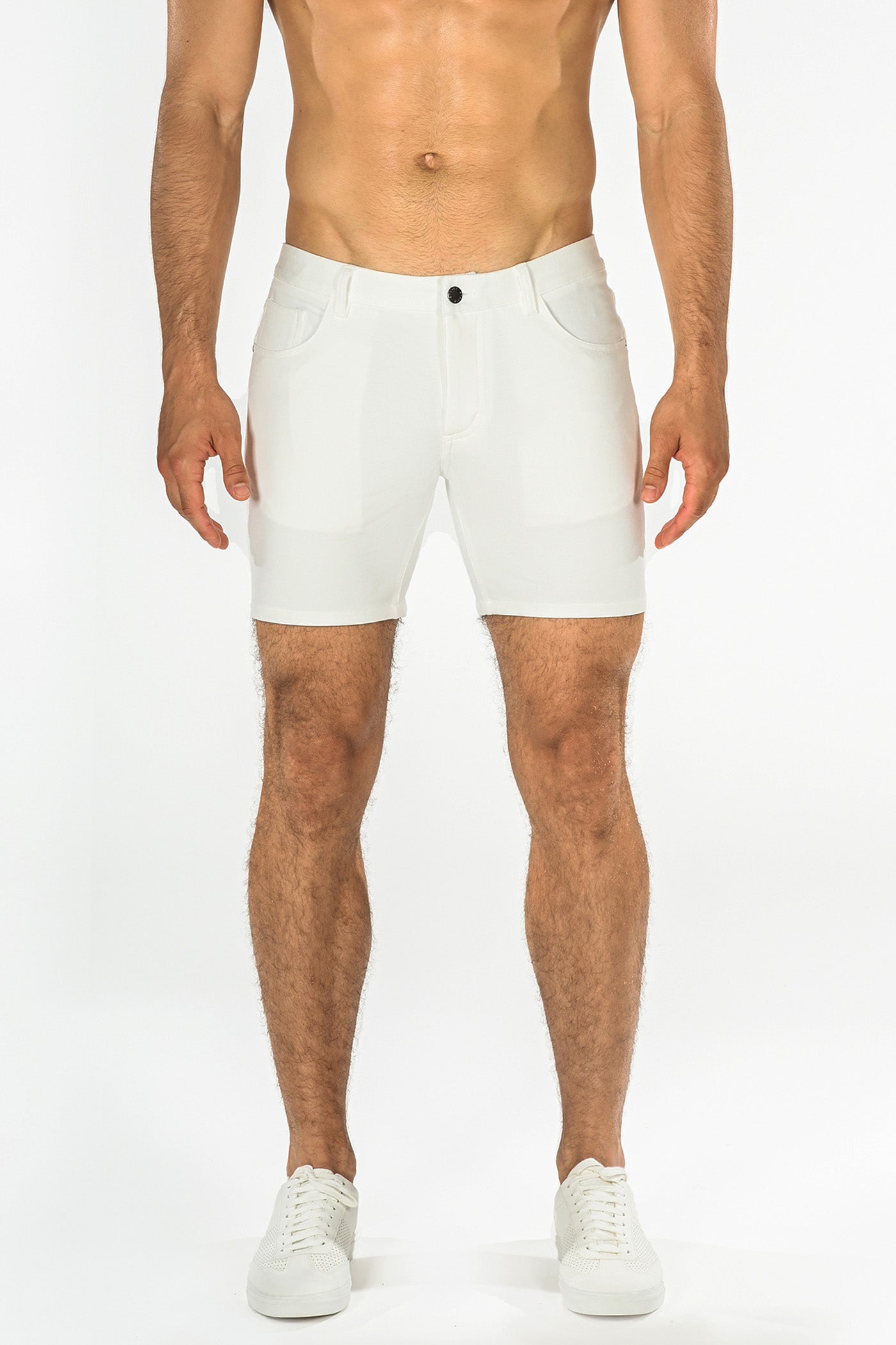 White stretch knit athletic shorts with sleek modern design and subtle stitching details