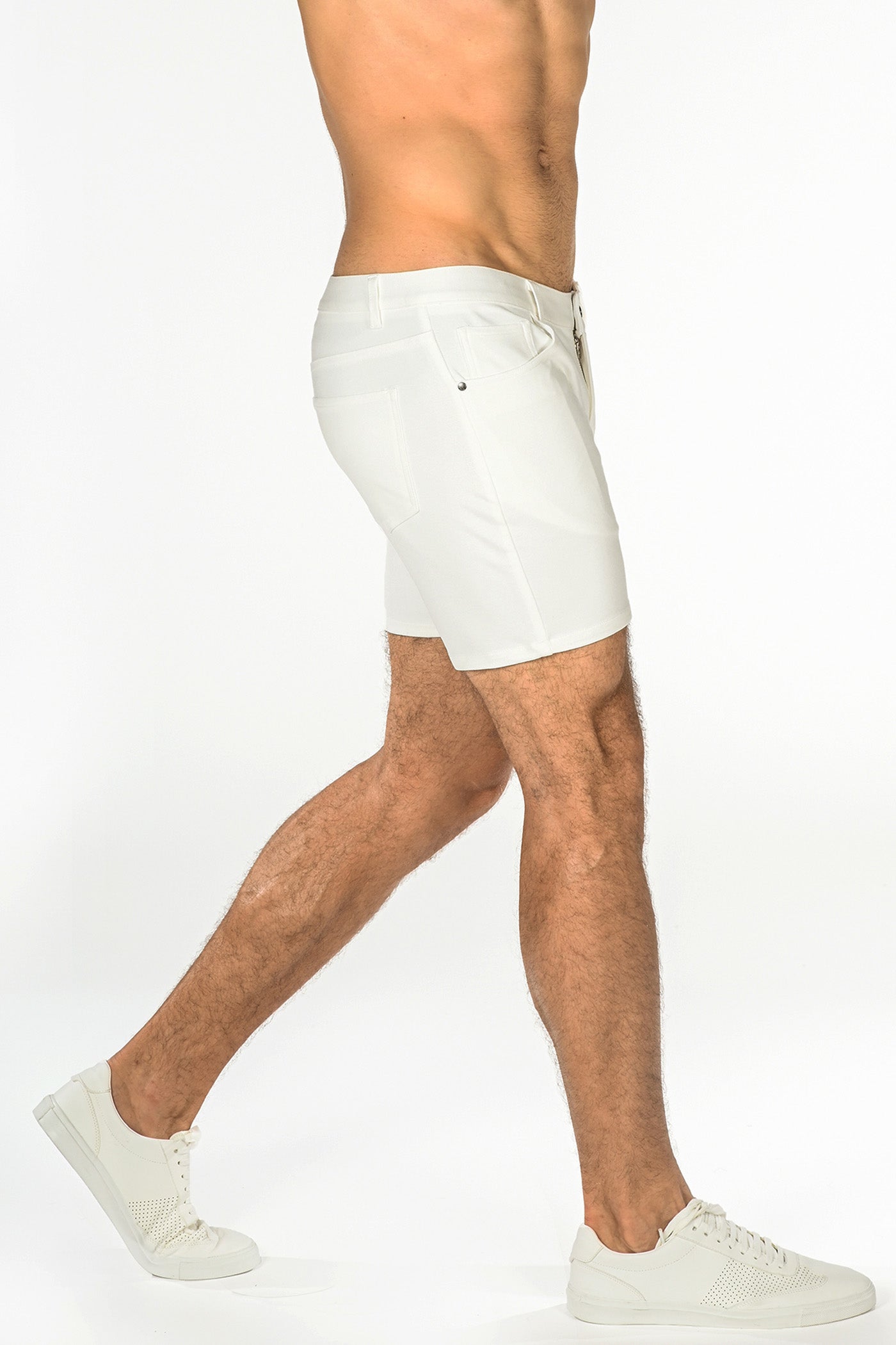 White stretch knit shorts with sleek modern design and subtle stitching details for athletic use