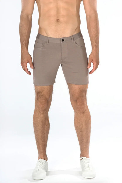 Beige stretch knit shorts with sleek modern design and subtle stitching details for versatile casual wear
