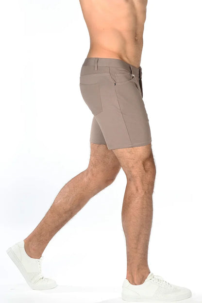 Beige stretch knit short with sleek modern design and subtle stitching details for athletic wear