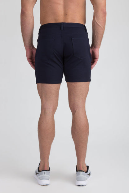 Navy blue stretch knit shorts with tailored fit and subtle stitching details for a sleek modern look
