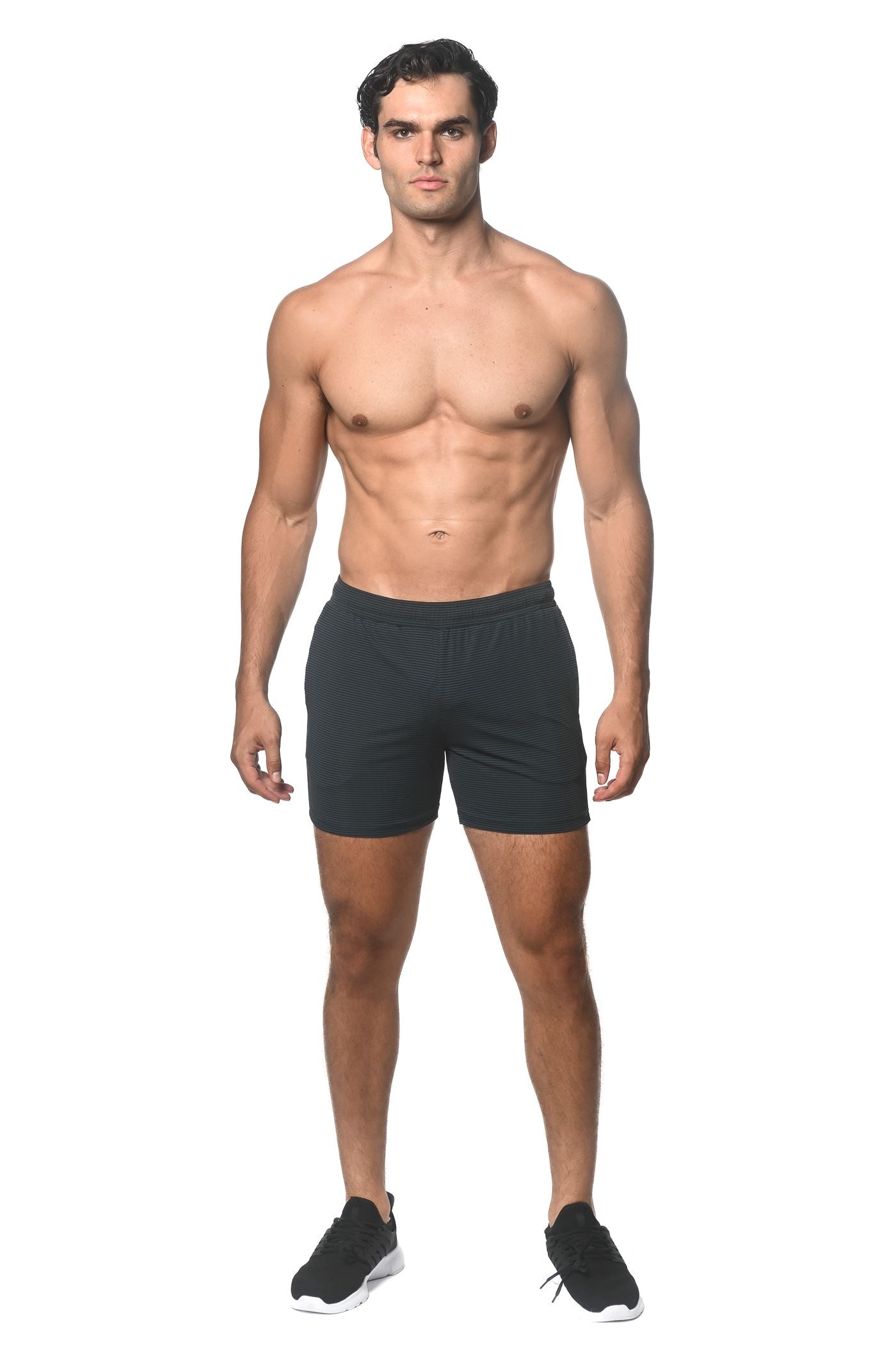 Black stripe stretch performance shorts with subtle textured pattern and elastic waistband for athletic use