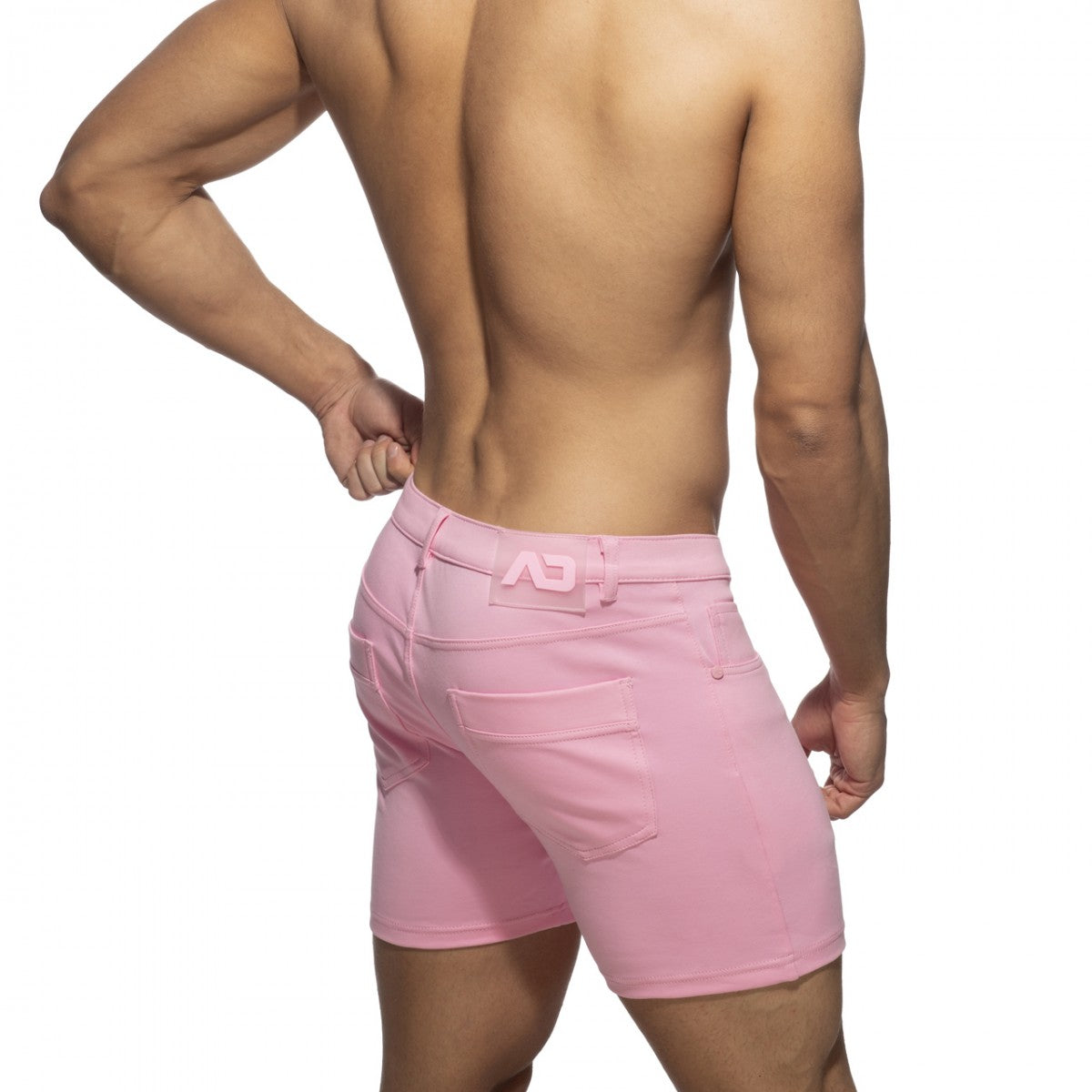 Pink denim svelte shorts with a subtle logo on the waistband front side