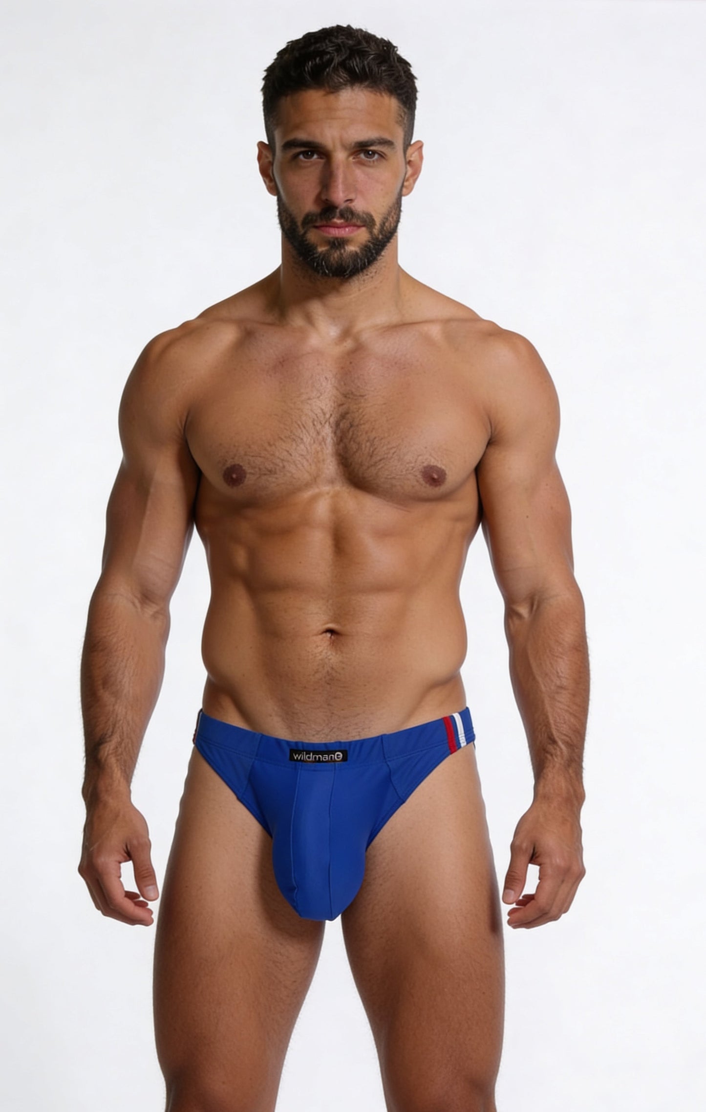 WildmanT royal blue swim thong with a "Big Boy" pouch and red and white side-stripe detailing on the waistband.