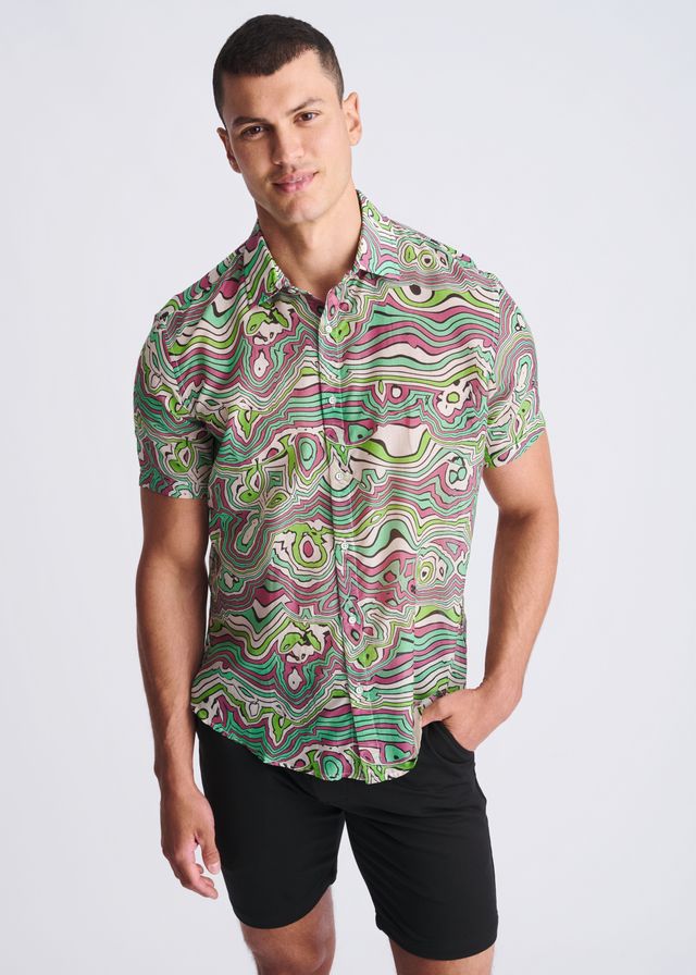 A vibrant short sleeved button up shirt with psychedelic green pink and white swirl pattern made from lightweight cotton silk