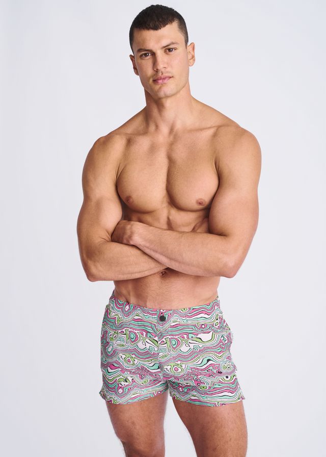 Men’s swirls print seersucker swim shorts with mesh lining featuring vibrant pink green and white abstract wave pattern on gray