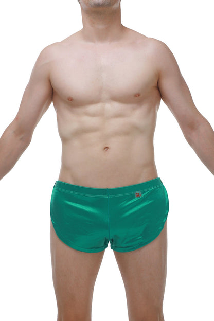 Shiny emerald green satin swim trunks with subtle waistband logo perfect for stylish beachwear and swimming