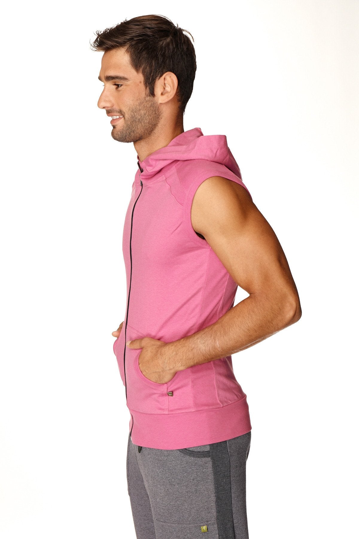 Pink sleeveless hooded zip-up vest made of breathable fabric designed for yoga and active wear in berry color